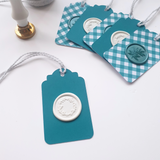 Teal and white wax seal gift tags