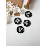 Black and white wax seals